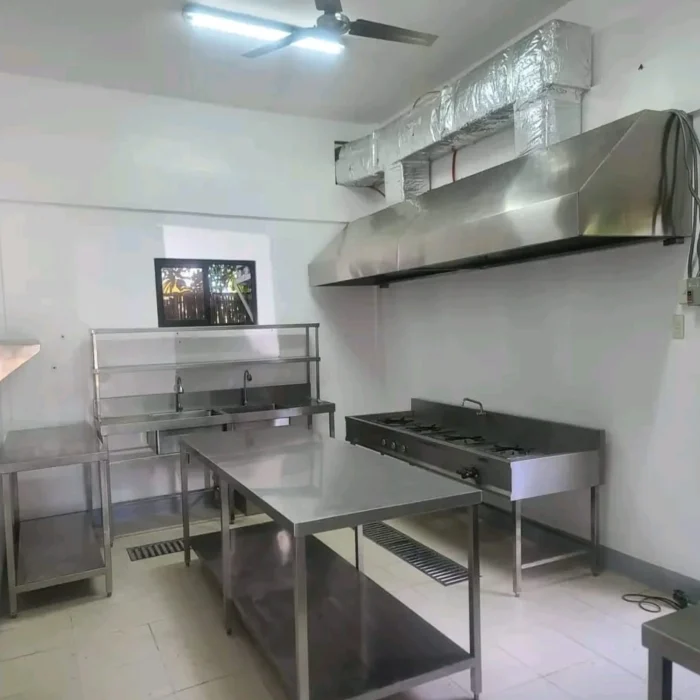 Kitchen hood with filters, extractor fun, duct, installation made of stainless steel